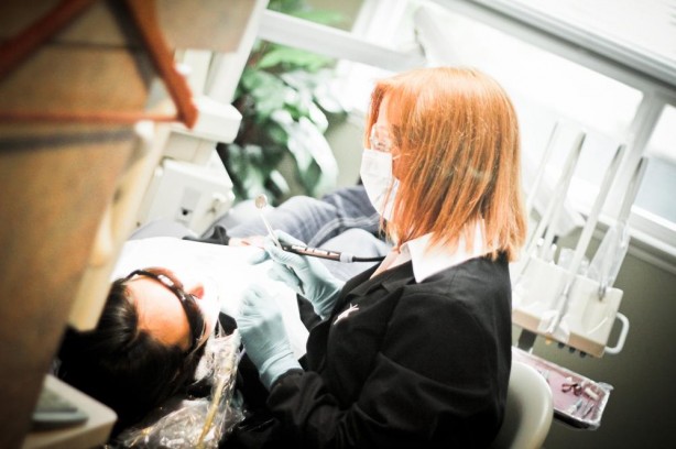 Our dental hygienist in Lynnwood, WA performing a dental cleaning on an actual patient.